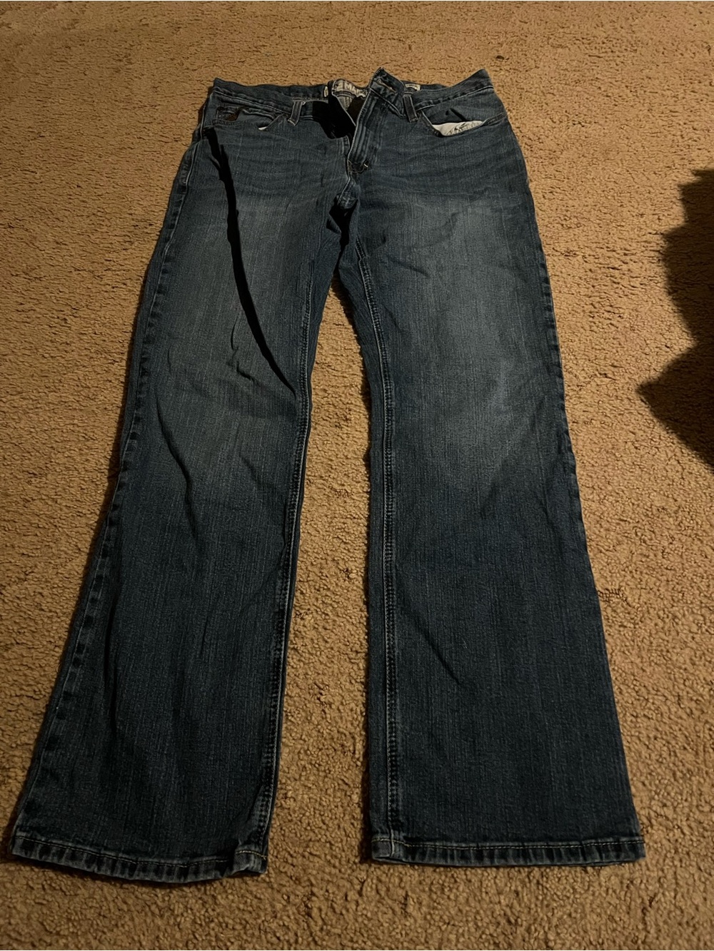 ariat men jeans, big whole on back pocket, easy to fix if you can sew